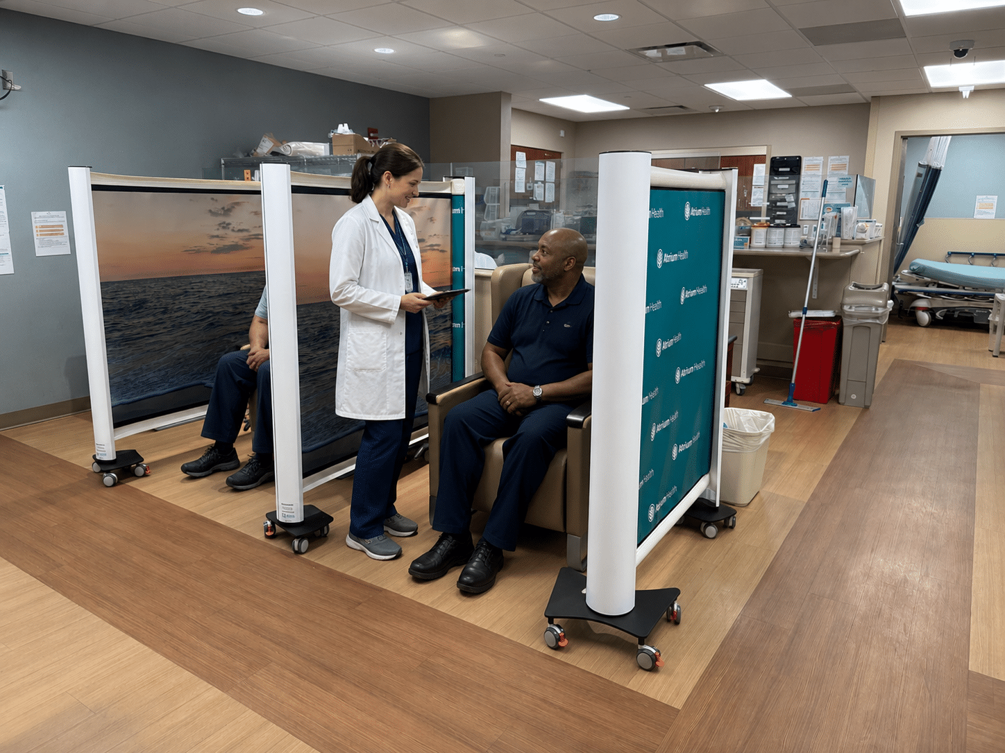 Retractable medical partition creating a private patient bay in a clinical environment